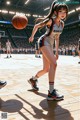 A girl in a basketball uniform dribbling a basketball on a court.